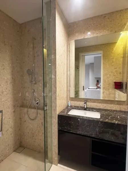 Bathroom features: marble wall cladding, glass shower enclosure, rain shower head, handheld shower, single-sink vanity with black marble top, mirror with built-in lighting, dark cabinetry, tile flooring; style: modern.