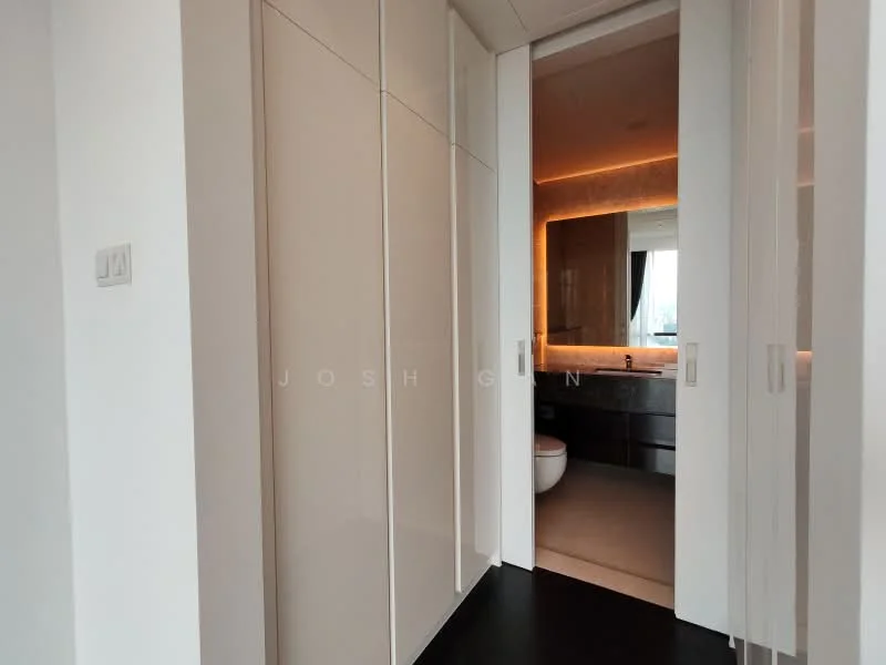 Room features: white cabinetry, sliding doors, black flooring, backlit mirror, modern lighting, neutral wall color, visible bathroom area, minimalist design; style: modern.