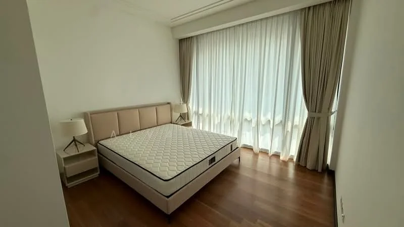 Bedroom features: queen-size bed, upholstered headboard, two bedside lamps, wooden flooring, floor-to-ceiling windows, sheer curtains, curtains in light beige, neutral wall color; style: modern.