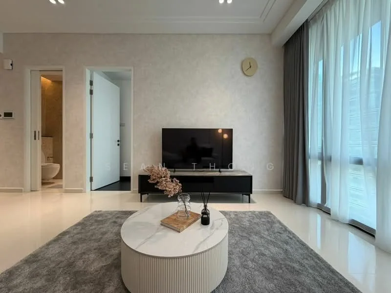 Living features: light grey wallpaper, white ceiling with recessed lighting, large floor-to-ceiling windows with sheer curtains, grey area rug, round coffee table with textured surface, black TV console, wall-mounted TV, decorative vase on coffee table, clock on wall, neutral-toned flooring; style: modern. Room features: white door, light brown wall, visible bathroom door.