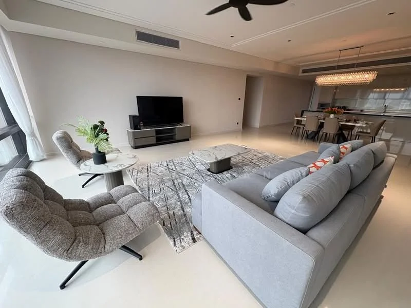 Living features: grey fabric sofa, 2-seater sofa, coffee table, area rug with geometric pattern, wall-mounted TV, TV console, 5-blade ceiling fan, large windows with sheer curtains, decorative plants, light-colored walls, recessed ceiling lights, dining area visible in background; style: modern.