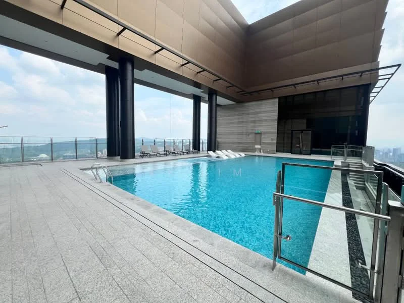 Exterior type: high-rise condominium; features: infinity pool, pool deck with loungers, glass railing, stone-paved flooring, city skyline view, covered area with overhang, outdoor seating area; style: modern.