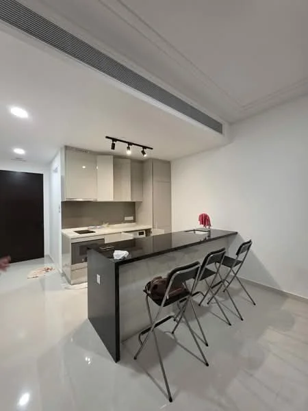 Kitchen features: white cabinets, grey cabinets, black countertop, stainless-steel sink, chrome pull-down faucet, built-in oven, induction hob, recessed LED downlights, pendant lighting, bar seating with three stools, glossy tile flooring, white painted walls, open layout; style: modern.