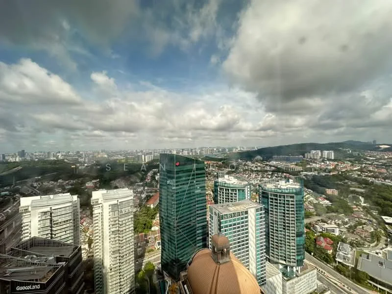 Exterior type: high-rise condominium; features: city skyline view, surrounded by urban landscape, multiple high-rise buildings, green hills in background, cloudy sky, glass facade buildings, varied architectural styles; style: modern.