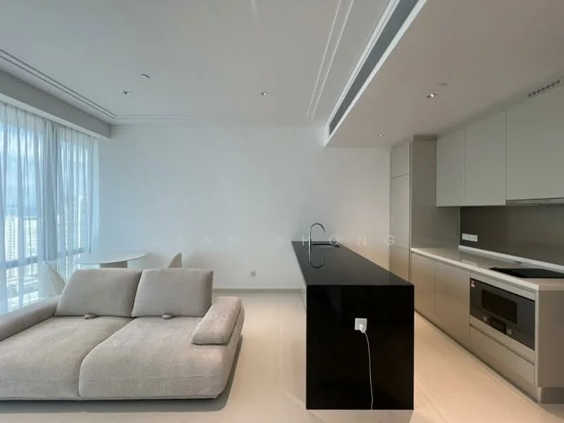 Living features: large grey fabric sectional sofa, black kitchen island with integrated sink, built-in oven, stainless-steel range hood, white cabinetry, white walls, floor-to-ceiling windows, light-colored tile flooring, recessed downlights, open-plan layout, dining table for two, city view through windows; style: modern; view: city.
