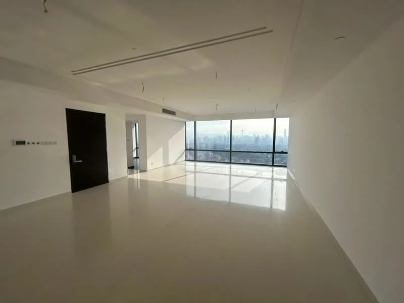 Living features: white painted walls, polished concrete flooring, floor-to-ceiling windows, city view, recessed downlights, minimalist design, open layout, no visible furniture; style: modern; view: city.