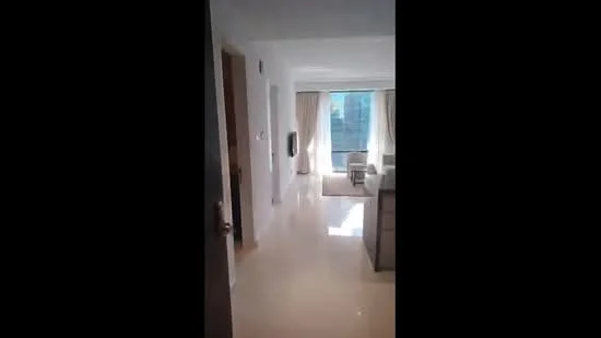 Room features: white painted walls, glossy marble tile flooring, large windows with sheer curtains, natural light flooding in, neutral color palette, open layout, doorway leading to another room, visible furniture in the background; style: modern; view: garden.