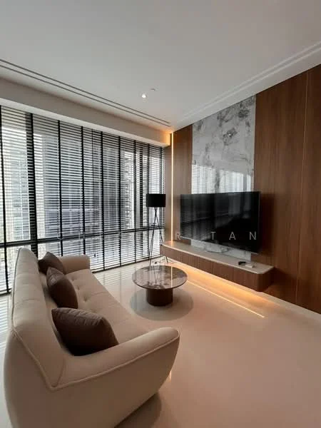 Living features: beige fabric sofa, two brown decorative cushions, round coffee table, wall-mounted flat-screen TV, wood paneling on wall, marble accent wall, floor-to-ceiling windows, black vertical blinds, recessed ceiling lights, light-colored flooring; style: modern.