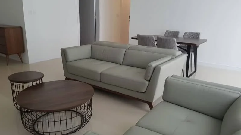 Living features: light grey leather sofa, 2-seater sofa, 3-seater sofa, wooden coffee table with round shape, metal wire coffee table, dining table with black finish, 4 upholstered dining chairs, cream painted walls, polished concrete flooring, floor-to-ceiling windows, natural light, minimalist decor; style: modern.