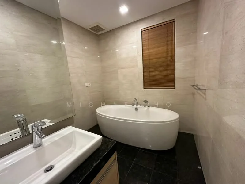 Bathroom features: freestanding bathtub, single-sink vanity with black countertop, chrome basin mixer faucet, wall-mounted mirror, tile cladding on walls, dark stone flooring, wooden window blinds, recessed lighting; style: modern.