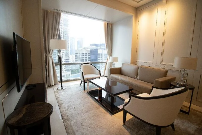 Living features: beige fabric sofa, 2 armchairs with white upholstery, coffee table with dark wood and glass top, TV console with dark wood finish, wall-mounted flat-screen TV, light-colored area rug, floor-to-ceiling windows, sheer curtains, recessed lighting, decorative wall paneling; style: modern; view: city.