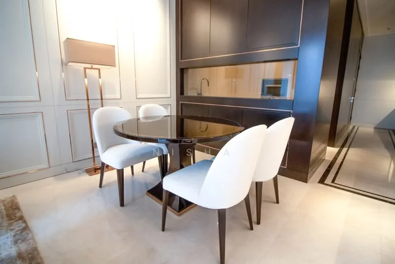 Dining features: round dining table with black glass top, 4 upholstered dining chairs in white, dark wood cabinetry, wall with decorative paneling, floor-to-ceiling windows, lampshade floor lamp, light-colored flooring, recessed lighting; style: modern.