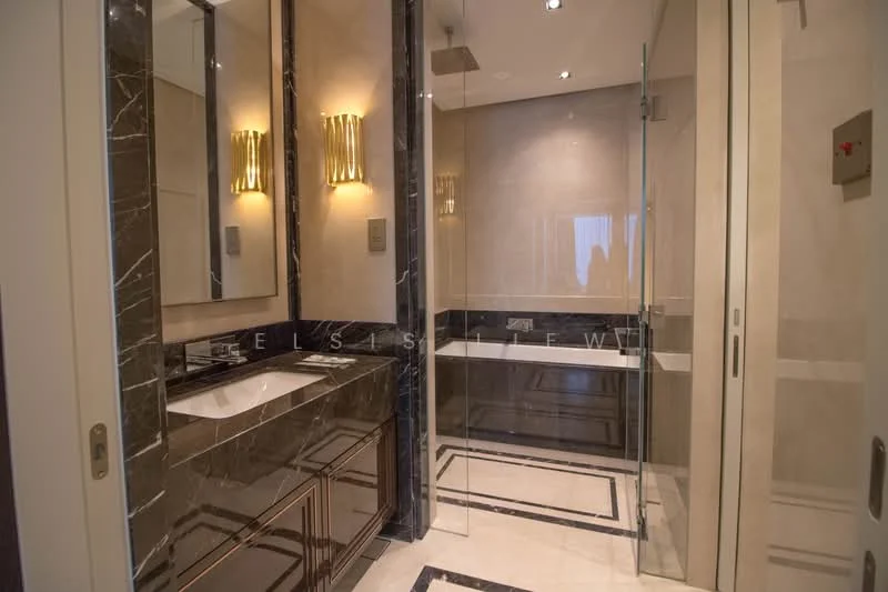 Bathroom features: double-sink vanity with dark wood cabinet, white marble countertop, framed mirror, chrome basin mixer faucets, walk-in shower with glass enclosure, rain shower head, freestanding bathtub, tile cladding to half wall, recessed downlights, wall sconces, black marble flooring, neutral wall colour; style: luxury.
