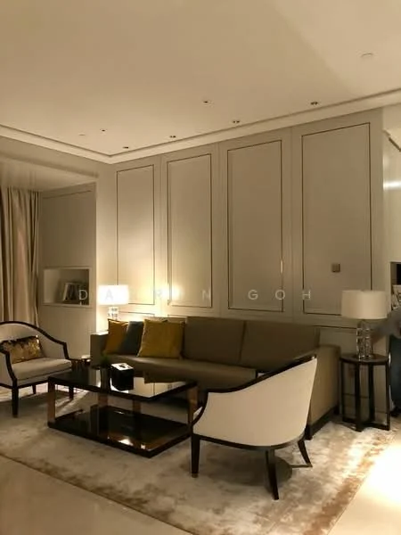 Living features: 3-seater beige sofa, 2 accent chairs with white upholstery, glass coffee table with black frame, decorative cushions in green, area rug with neutral tones, recessed ceiling lights, wall-mounted lighting fixtures, built-in cabinetry with panelled design, floor-to-ceiling curtains, white painted walls, crown moulding; style: modern.