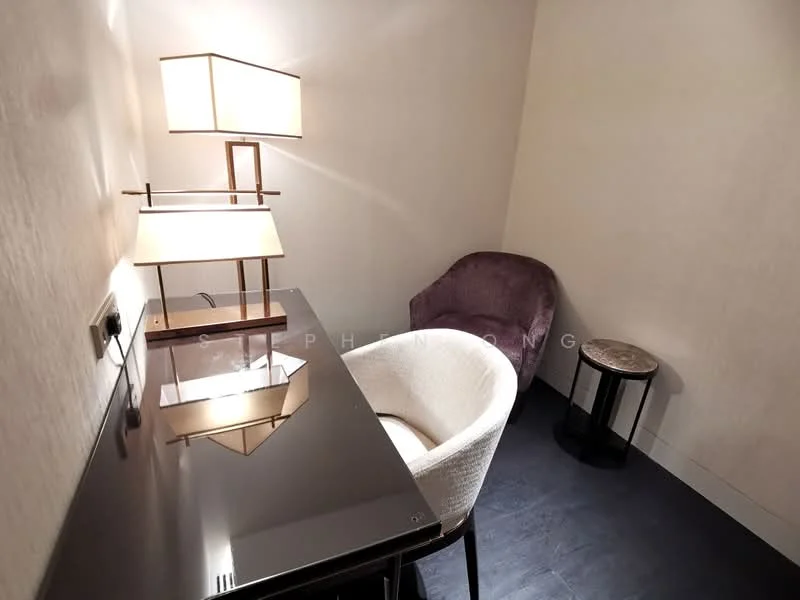Study features: black glossy desk, white upholstered chair, purple accent chair, small round side table, table lamp with square shade, textured wall, dark flooring, wall-mounted power outlet; style: modern.
