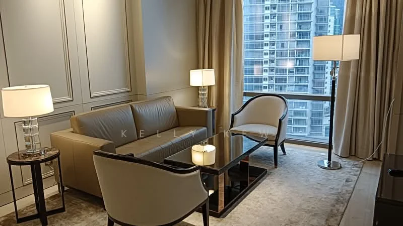 Living features: 3-seater leather sofa in beige, 2 accent chairs with curved backrest, glass coffee table, side table with lamp, floor lamp, light-colored curtains, carpeted flooring, wall paneling, large window with city view; style: modern; view: city.