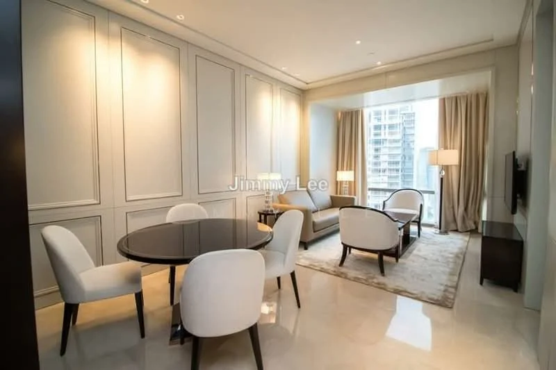 Dining features: round dining table, 4 white upholstered dining chairs, cream walls with paneling, marble flooring, recessed downlights, floor-to-ceiling windows, curtains, decorative area rug, wall-mounted TV, sofa, side table with lamp; style: modern; view: city.