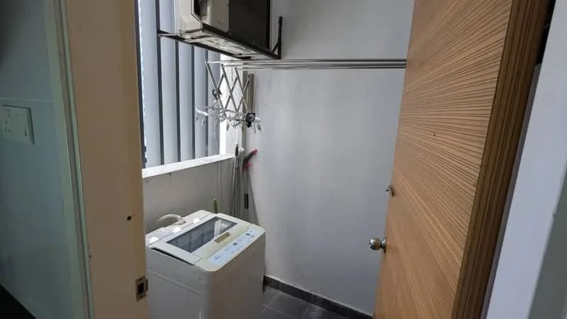 Laundry features: top-load washing machine, metal drying rack, white walls, grey tile flooring, window with vertical blinds, door with wooden finish.
