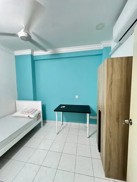 Bedroom features: single bed with mattress, white bed frame, light blue painted walls, white ceiling, 5-blade ceiling fan, white tiled flooring, wooden wardrobe, black study table, window with no visible treatment, air conditioning unit; style: modern.