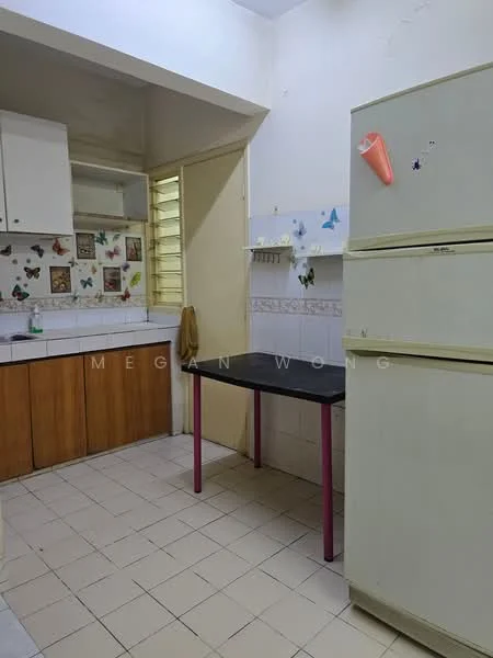Kitchen features: white walls, cream cabinetry, wooden lower cabinets, black table with pink legs, stainless-steel fridge, tile flooring, window with horizontal slats, decorative wall stickers, sink, countertop space.