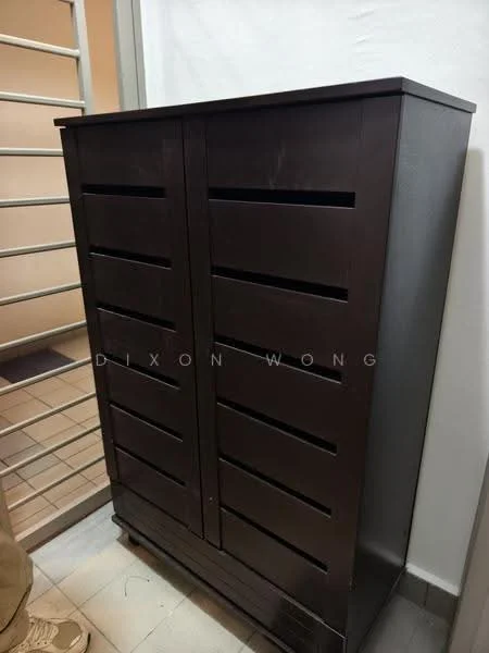 Room features: dark wood cabinet, slatted design, two doors, floor-standing, minimalist style; style: modern.