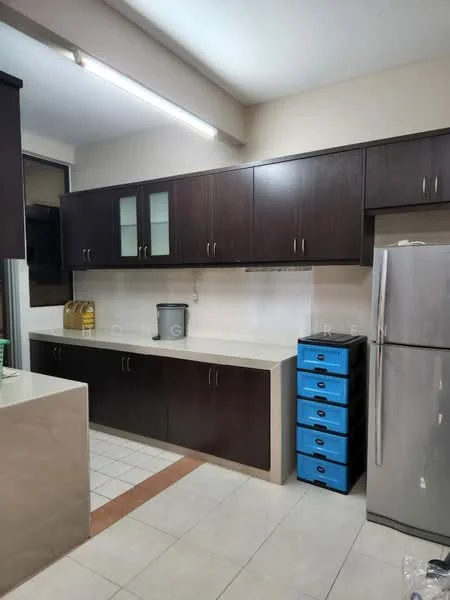 Kitchen features: dark wood cabinetry with glass-front upper cabinets, light-colored countertop, stainless-steel fridge, blue storage drawers, tile flooring, under-cabinet lighting, sink, kitchen window, neutral wall color, open layout; style: modern.