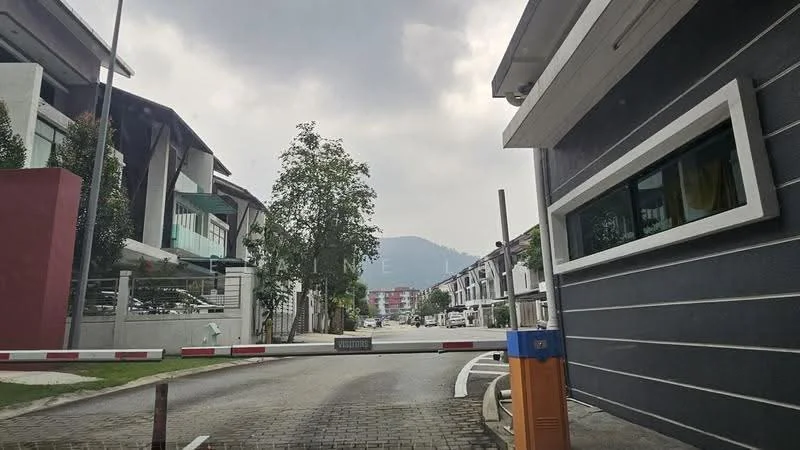 Exterior type: linked terrace house; features: grey painted facade, manicured lawn, paved driveway, security gate, surrounded by greenery, mountain view in background; style: modern.