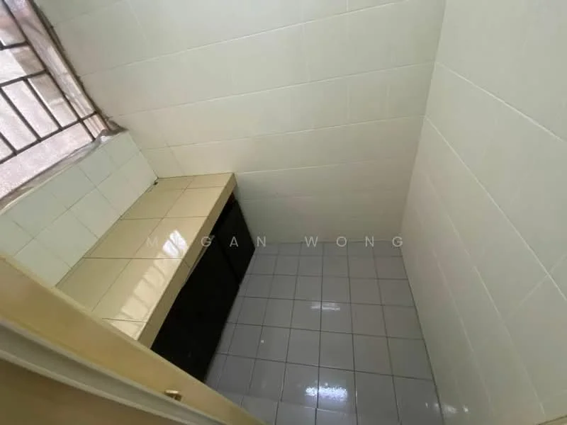 Room features: white tiled walls, light grey floor tiles, countertop with beige tiles, black cabinetry, window with metal grille, natural light from window.
