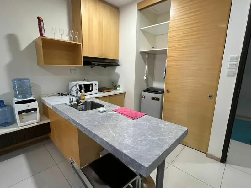 Kitchen features: grey marble countertop, single-bowl stainless-steel sink, chrome pull-down faucet, built-in microwave, white freestanding fridge, wood cabinetry, glassware on shelf, water dispenser, tile flooring, wall-mounted kitchen cabinet, open shelving, stool at counter; style: modern.