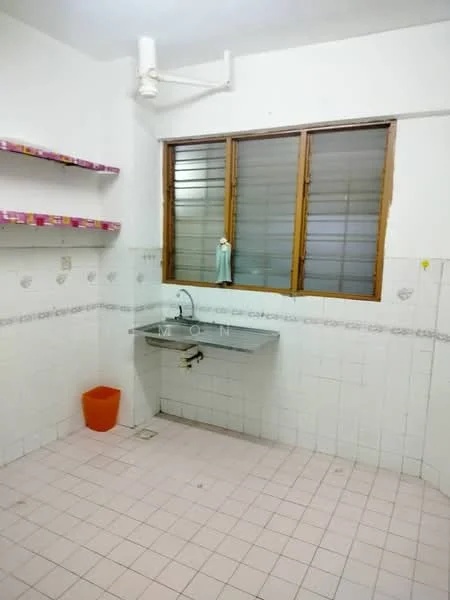 Laundry features: white tiled walls, pink tiled backsplash, grey ceramic tile flooring, single-bowl stainless-steel sink, wall-mounted faucet, wooden shelves, orange plastic bin, horizontal sliding windows with brown frames.