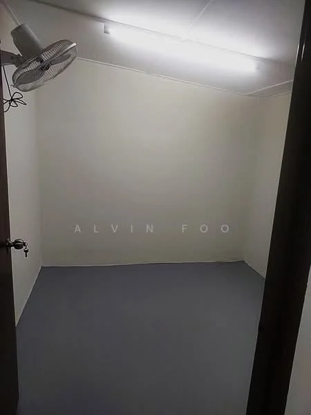 Room features: grey painted walls, grey flooring, ceiling light, wall-mounted ceiling fan.