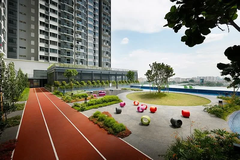 Exterior type: high-rise condominium; features: running track, landscaped garden, lawn area, outdoor seating with colorful chairs, swimming pool, planter boxes with greenery, view of city skyline, multi-storey building, glass railing, terrace area; style: modern.
