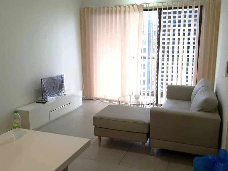 Living features: light beige sectional sofa, glass coffee table, white TV console, wall-mounted TV, floor-to-ceiling windows, sheer vertical blinds, light grey tiled flooring, decorative wall with no visible artwork; style: modern; view: city.