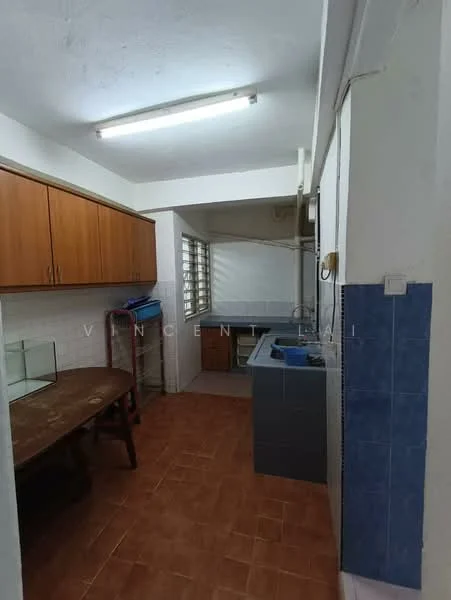 Laundry features: brown wooden cabinetry, grey countertop, stainless-steel sink, washing machine, tile flooring in brown, white walls, fluorescent ceiling lights, window with metal grilles.