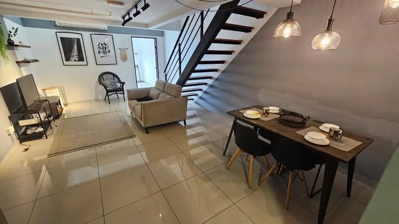 Living features: grey fabric 3-seater sofa, black coffee table, wall-mounted TV, area rug with geometric pattern, pendant lighting, floor-to-ceiling windows, white painted walls, polished ceramic tile flooring; style: modern. Dining features: wood dining table, 4 black dining chairs, table setting with plates and cups, pendant lighting, white painted walls, polished ceramic tile flooring; style: modern.