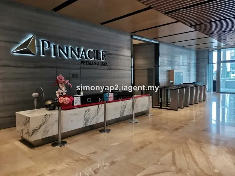 Room features: marble flooring, grey marble feature wall, reception desk with red accents, decorative flowers, glass windows, wooden ceiling with slats, modern lighting fixtures, seating area, security counter, signage with logo; style: modern; view: city.