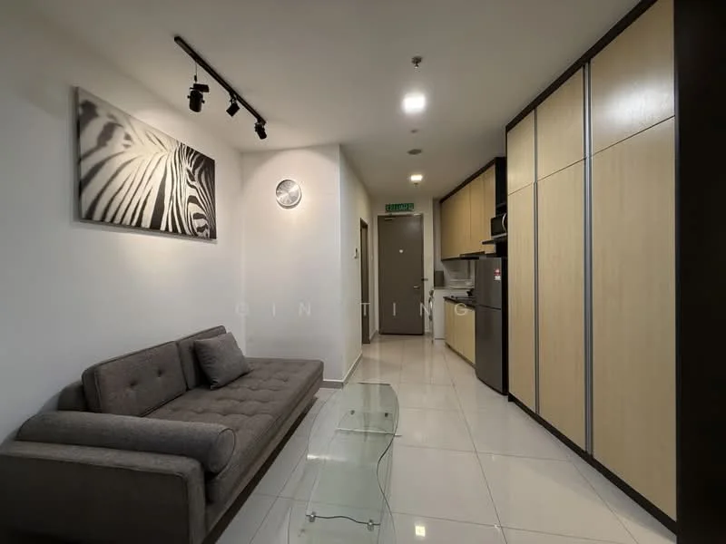 Living features: grey fabric sofa, glass coffee table, white painted walls, recessed LED downlights, track lighting, tile flooring, kitchen cabinetry with wood finish, built-in oven, microwave, stainless-steel sink, kitchen countertop, wall clock, framed artwork; style: modern.