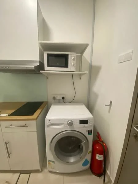 Laundry features: front-load washing machine, white cabinetry, microwave, wood countertop, fire extinguisher, tiled flooring, wall-mounted shelf, white walls; style: modern.