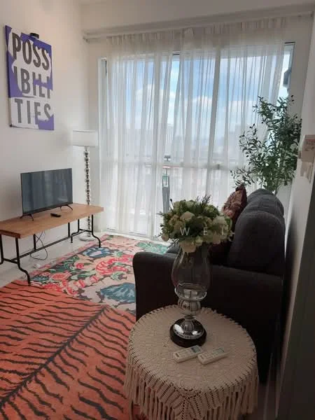 Living features: 3-seater fabric sofa in grey, coffee table with lace trim, area rug with floral pattern, wall-mounted TV, floor lamp, large windows with sheer curtains, decorative plants, framed artwork on wall; style: modern; view: city.