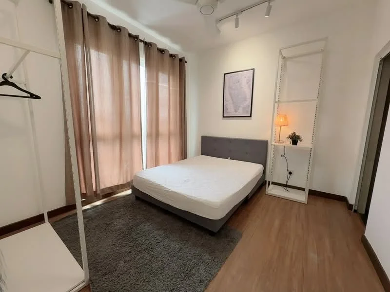 Bedroom features: queen-size bed, grey upholstered bed frame, wooden flooring, beige area rug, floor-to-ceiling windows, sheer curtains, brown blackout curtains, wall-mounted lamp, white shelving unit, clothes rack, decorative plant; style: modern.