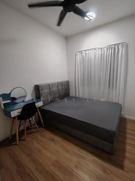 Bedroom features: queen-size bed with grey upholstered headboard, wooden flooring, white painted walls, ceiling fan, window with sheer curtains, study desk with drawer, round mirror on desk, black chair; style: modern.