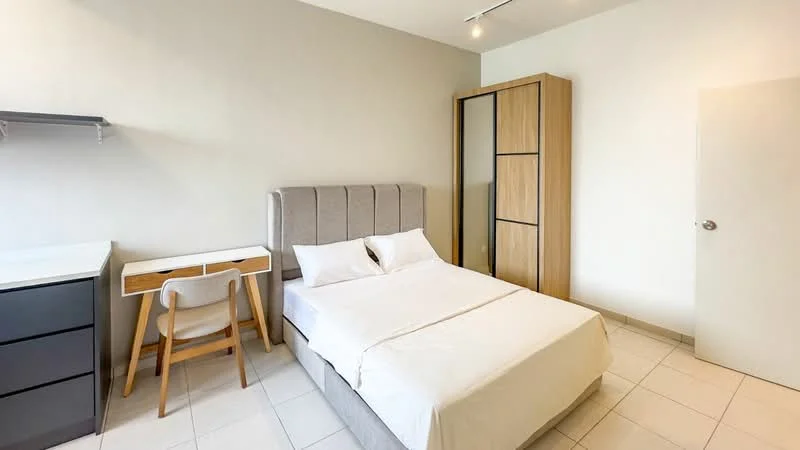 Bedroom features: queen-size bed with upholstered headboard, white bedding, light grey accent wall, built-in wardrobe with wooden finish, desk with wooden legs and white top, chair with fabric upholstery, tile flooring, recessed ceiling lights; style: modern.