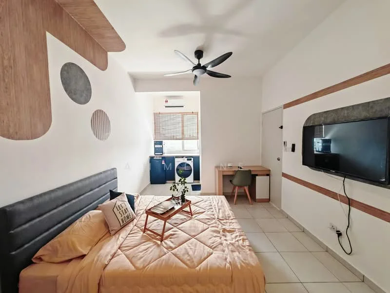Bedroom features: king-size bed with beige bedding, upholstered headboard, decorative throw pillows, ceiling fan with light, wall-mounted TV, wood accent wall with circular designs, desk with chair, built-in wardrobe, tile flooring, window with blinds, laundry area visible in background; style: modern.