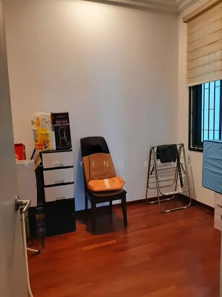 Room features: wooden flooring, white painted walls, window with black grille, roller blinds, chair, folding clothes drying rack, storage boxes, black storage cabinet.