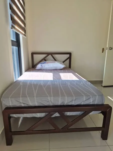 Bedroom features: single bed, brown wooden bed frame, grey bedspread with white stripes, pillow, window with blinds, light-colored walls, tile flooring, door, natural light.