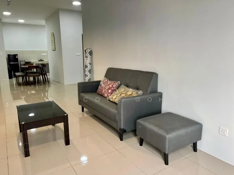 Living features: 3-seater fabric sofa in grey, decorative cushions in various colors, glass coffee table with dark wood legs, ottoman in grey fabric, cream painted walls, glossy tile flooring, recessed ceiling lights, open layout to dining area; style: modern.