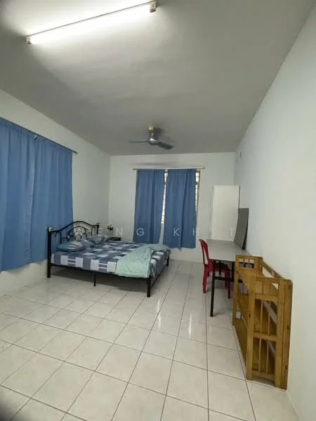 Bedroom features: white painted walls, tile flooring, ceiling fan, blue curtains, double bed with blue bedding, study desk, red chair, wooden shelving unit.