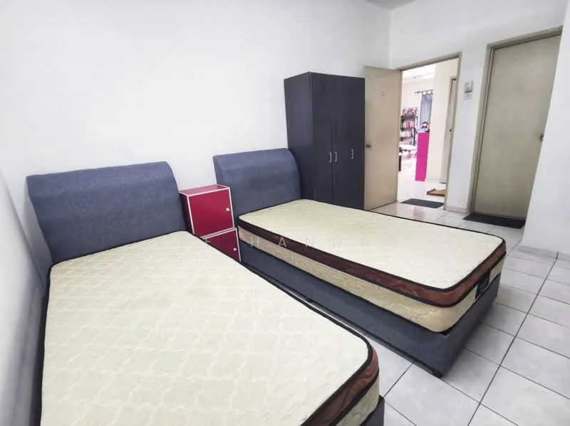 Bedroom features: two single beds with mattresses, grey upholstered headboards, white tiled flooring, white painted walls, built-in wardrobe in dark wood, red bedside table, doorway leading to another room.