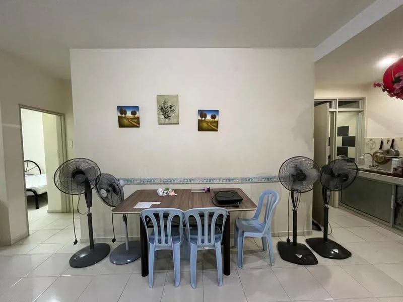 Dining features: dining table, 4 plastic chairs in light blue, 2 standing fans, white tiled flooring, cream painted walls, framed artwork on walls, open layout to kitchen, window to adjacent room. Room features: doorway leading to bedroom, visible kitchen area in background.