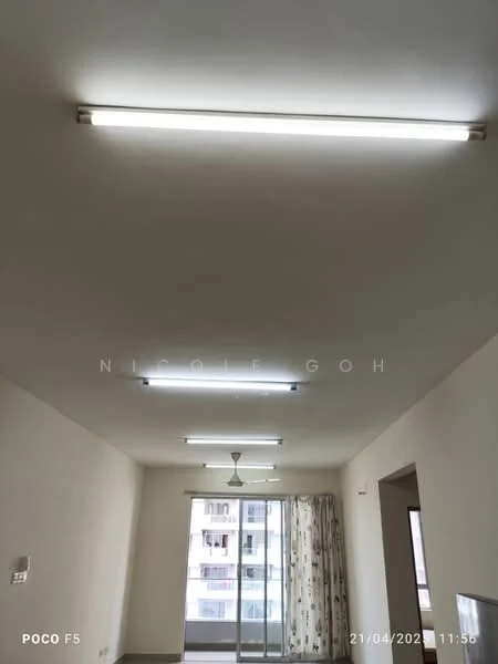 Room features: white painted walls, ceiling with fluorescent lights, 5-blade ceiling fan, floor-to-ceiling sliding glass door, curtains with floral pattern, tile flooring.